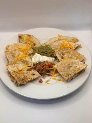 We offer quesadillas as an appetizer! Your choice of ground or fajita beef, fajita chicken, pulled pork, shrimp, or spinach!