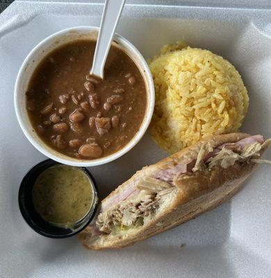 Half Cubano with yellow rice, red beans & hot green sauce!