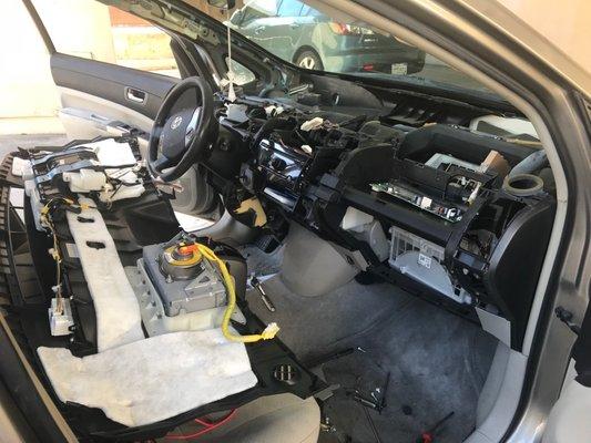 My dashboard taken apart to get it fixed by EV HYBRID TECH