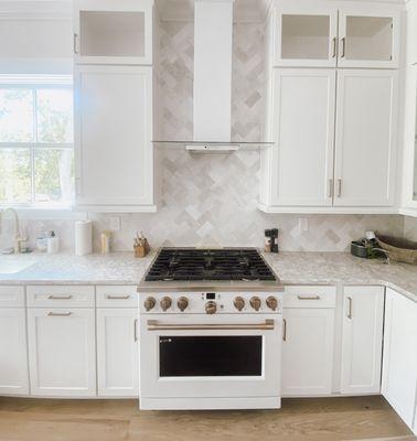 A backsplash installed in a kitchen with a herringbone pattern