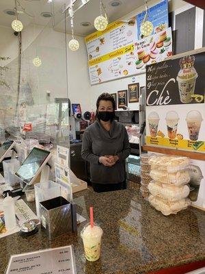 The owner in her hole in the wall counter