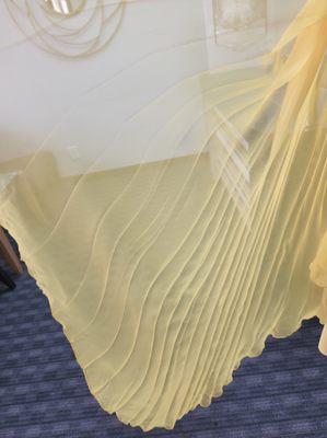 The pleating that was redone by Millennium Cleaners