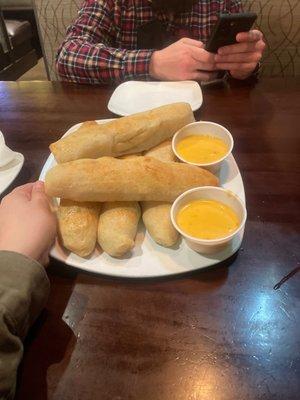 Breadsticks with cheese sauce