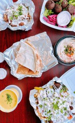 Clockwise: Tahini & cauliflower, falafel plate, hummus & pita, loaded fries + falafel, lentil soup!