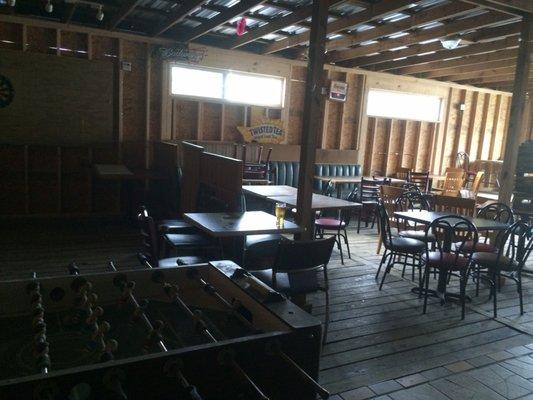 Covered patio with foosball, darts, jenga