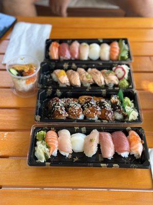 Uni and ikura don (the small cup), omakase nigiri, salmon aburi, unagi nigiri