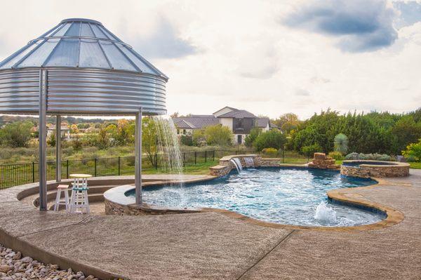 Rain curtain from a silo.  Best Water Feature in Texas!
 
 pool builder near me