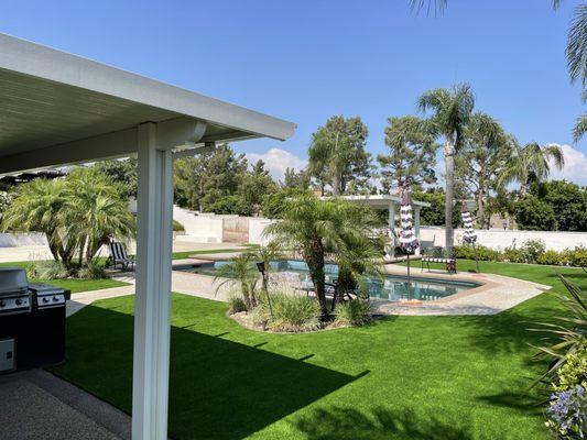 Artificial grass is the perfect pairing for around the pool.