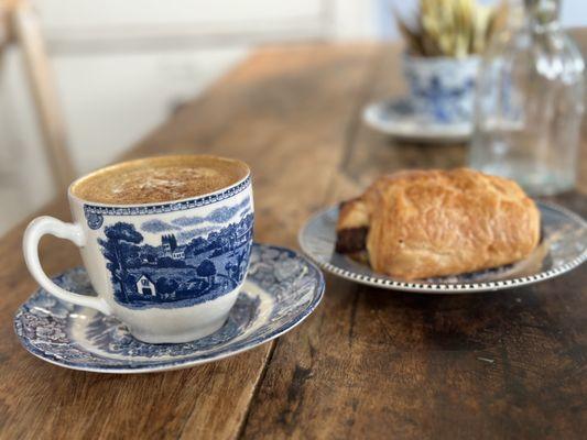 Cappuccino  with nutmeg and croissant