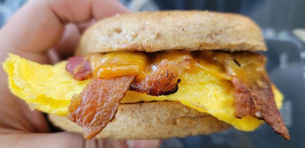 Classic breakfast sandwich with bacon for the meat and bagel for the bread