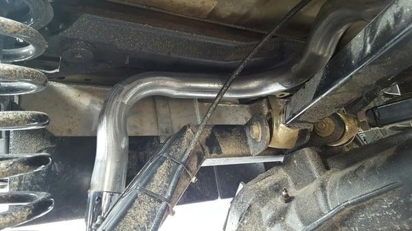 A snake of an exhaust around the 4 link suspension.