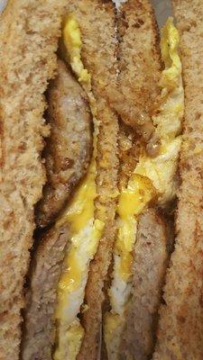 Sausage, egg, and cheese breakfast sandwich (bland, soggy toast, not very good)