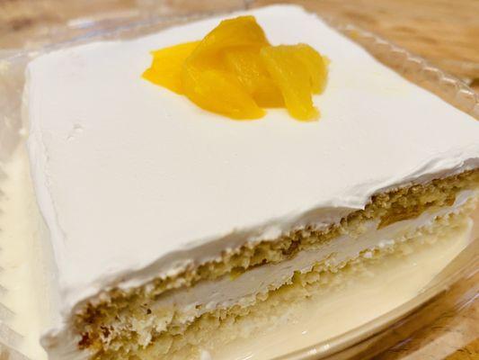 Tres leches cake with peaches hubby loves :)...