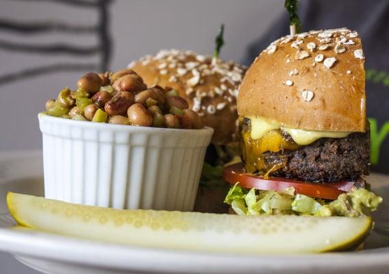 House-made black bean burger with melted cheddar, fresh guacamole, cilantro-lime mayo, lettuce & tomato on a toasted whole-wheat bun!