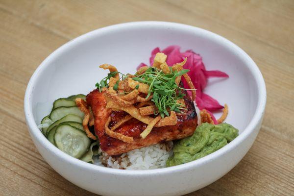 Maple Ginger Glazed Salmon Bowl: Pan Seared Scottish Salmon, Asian Sticky Rice, Guacamole, Pickled Red Onions, Quick Pickles, Crispy Wontons