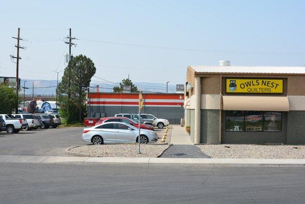 We share a building with Frame Depot.  The entrance to Owl's Nest Quilters faces south to HWY 6&50.