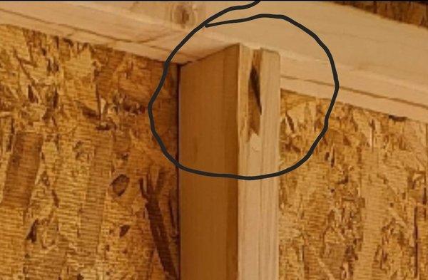 Nail securing support beam split the beam, protruding out of the front of the beam, and is not secure.