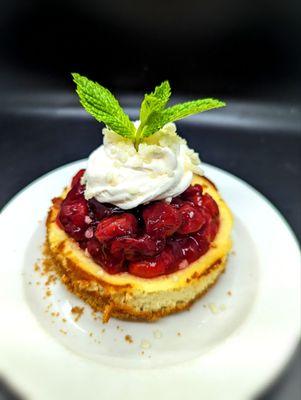 Mini Ricotta Cheesecake.  GF Toasted almond crust and a Brandied Cherry-Berry compote.