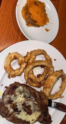 Ribeye with sweet potato casserole and onion rings