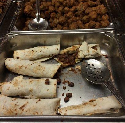 An open burrito contained dry meat and beans. Fried okra was limp.