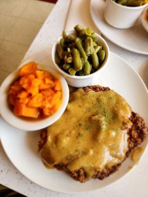 Chicken fried steak with sweet potatoes and green beans