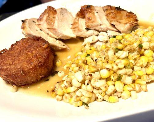 Roasted chicken breast and potato cake with seasonal corn as a side option