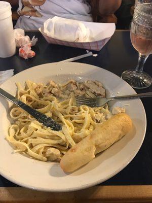 Half devoured chicken fettuccine Alfredo!