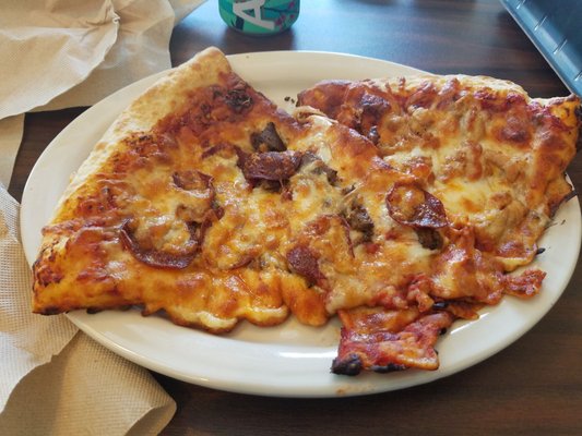 Really? This looks really sad.  The other slice is supposed to be pesto chicken. This pizza looks like it was previously chewed up