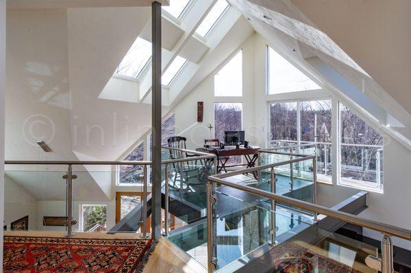 The remaining pictures of this glass railing project are located at https://cablerailing.com/2018/larry-ma/