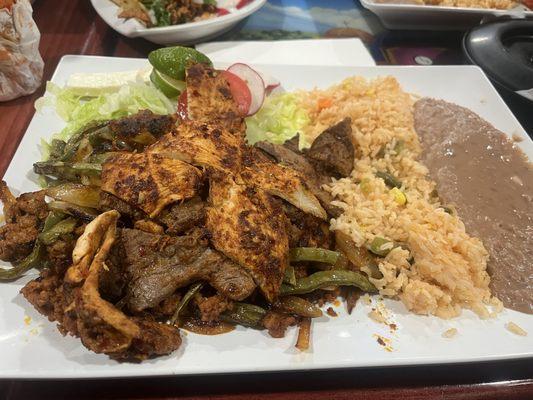 Chicken , Steak, rice , beans, cactus, salad.