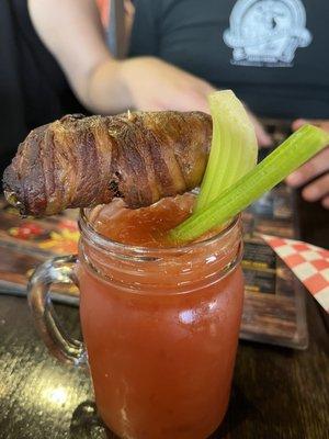 Bloody Mary with bacon wrapped jalapeño stuffed with cheese