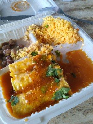 Chicken enchilada special with rice and beans, and spicy or mild salsa on the side.