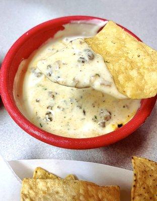 Start off with some cheesy delish queso & add the ground beef!