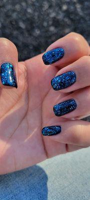 Black with blue glitter    gel nails