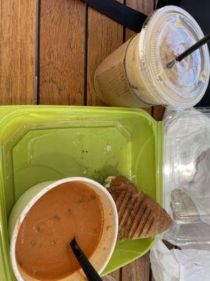 Half sandwich and soup combo plus tall iced coffee - pesto chicken panini and tomato basil soup. All delicious!