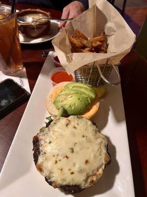 BLACK BEAN BURGER Guinness cheddar, mixed greens, sliced avocado and roasted jalapeño aioli