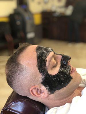 We do black masks on the face with a steam towel finish .