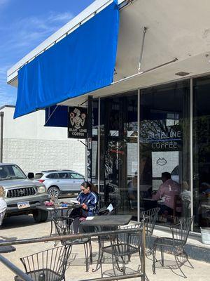 Outdoor seating + coffee shop store front