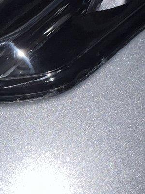 Crack on edge of headlamp from fender pushing into it. Employee told insurance it wasn't caused from the accident so it was not replaced.