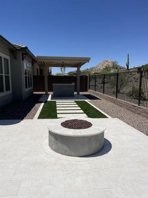 Grass and limestone feature and fire pit