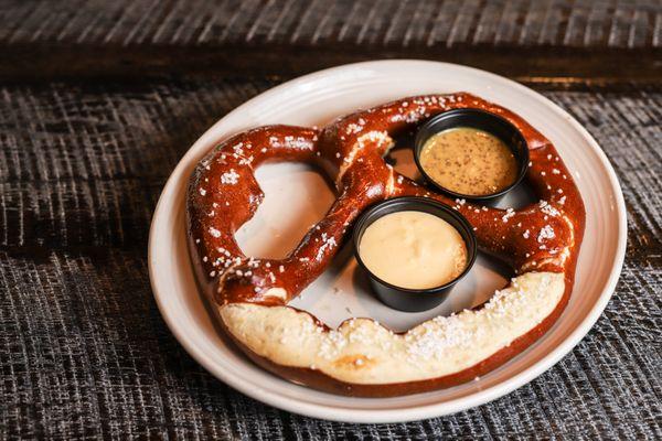 Giant Bavarian Pretzel served with American cheese sauce and pub mustard