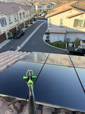 Freshly cleaned solar panels on the second story of a townhome in Oceanside