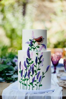 Our wedding cake! Included a cute bird at the top plus lavender design from the bottom of the cake up to tier two.