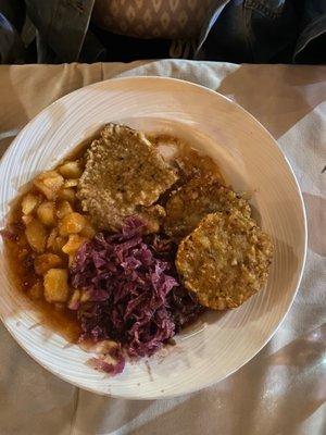 Veal schnitzel with purple cabbage, apple, and potato pancake.