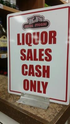 Cash only in liquor. Wine can be purchased with a card.