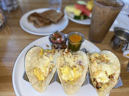 Juan's Breakfast Tacos & iced Oatmilk latte, toast & fruit.