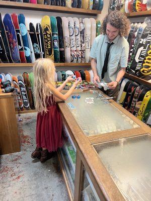 My daughter helping the crew build her first skateboard.