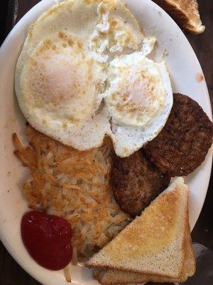 Two eggs over medium, sausage patties , hash browns and toast. My eggs were cooked perfectly :)