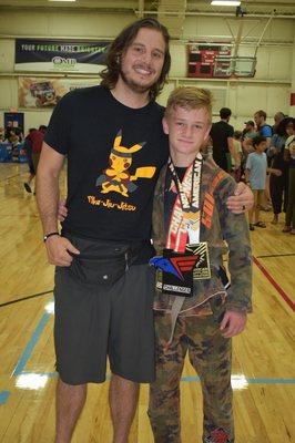 Liam with Coach Freeman after a competition.