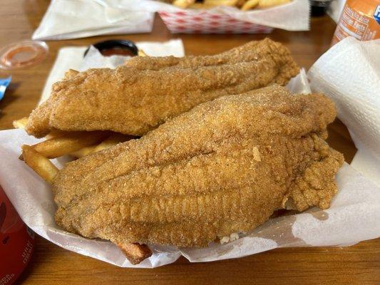 Two catfish fillets and four colossal shrimp! This came hot out of the grease and it was delicious!